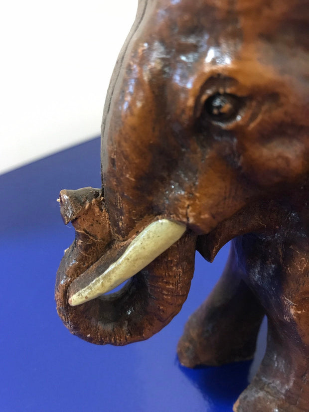 Syroco Wood Elephant Figure with White Tusks and Curled Trunk  from the 1940s